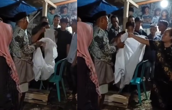 Warga mengamankan kain putih yang dipakai aksi teror pocong saat acara hajatan di Pati.