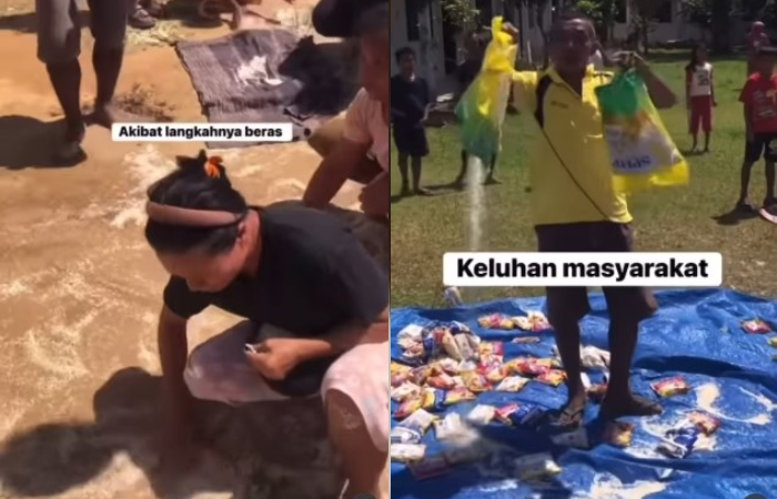 Warga korban banjir di Tapanuli Tengah punguti beras yang berceceran lantaran kemasan pecah saat dijatuhkan dari helikopter TNI.