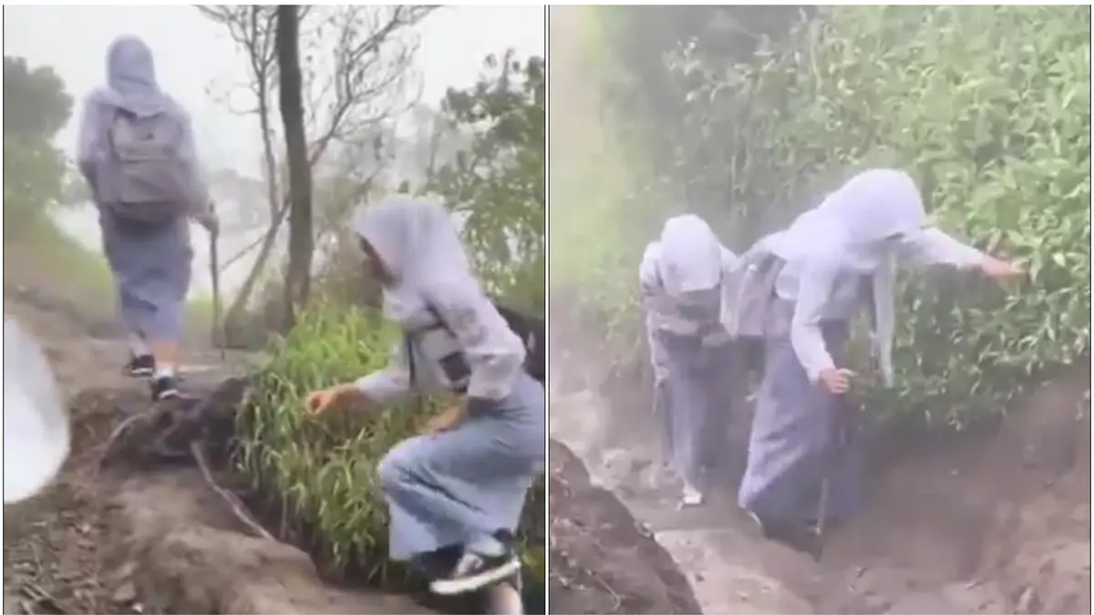 Tangkapan layar dua siswi yang masih berseragam sekolah naik-turun gunung. Narasi dalam video menyebut lokasinya di Gunung Merbabu, Jawa Tengah. (DOK.@@BEdoel___)