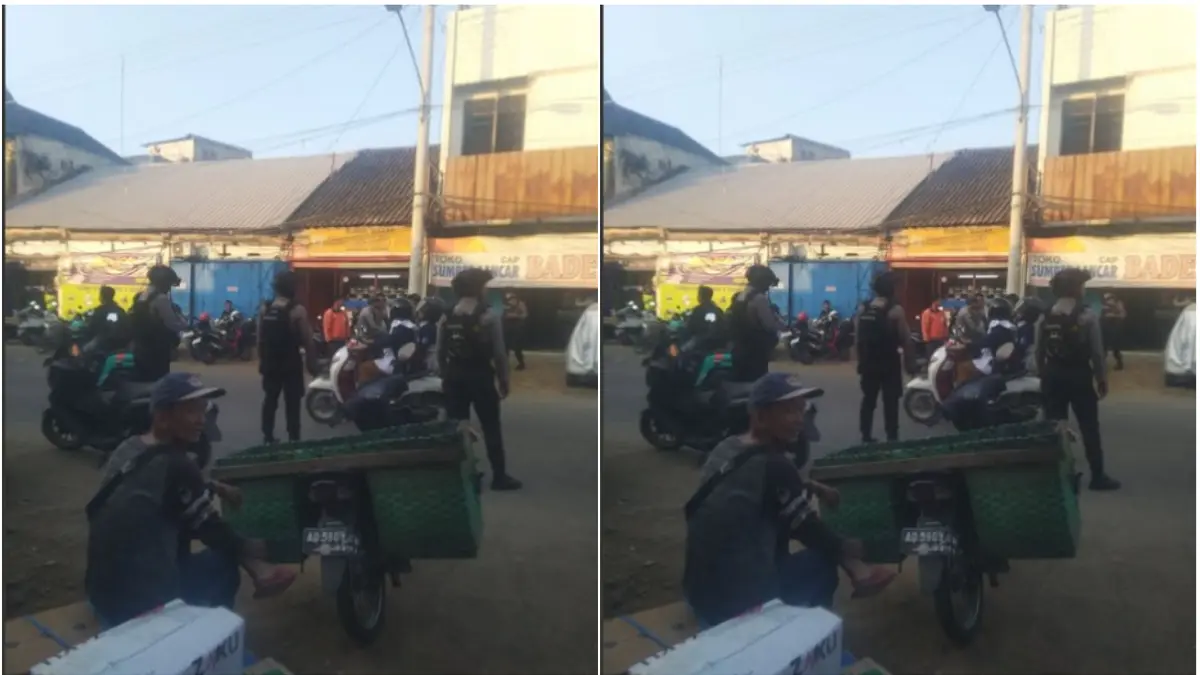 Polisi bersiaga di seberang toko emas di Jalan Pierre Tendean, Kelurahan Nusukan, Kecamatan Banjarsari, Rabu (10/6) sore. (TANGKAPAN LAYAR MEDSOS) 