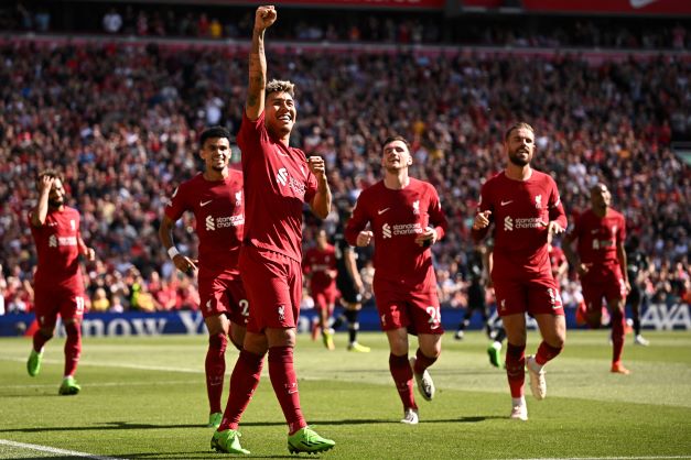 Striker Roberto Firmino mencetak 2 gol dan 3 umpan gol dalam laga kontra Bournemouth. (OLI SCARFF/AFP )