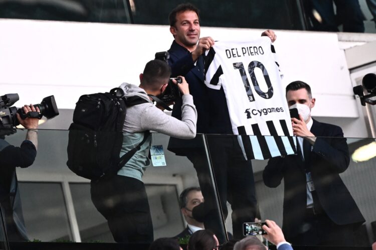 Italian former player Alessandro Del Piero holds a team jersey with his name before the start of Italian Serie A football match between Juventus and Bologna at the Allianz Stadium in Turin, on April 16, 2022. (Photo by MARCO BERTORELLO / AFP)