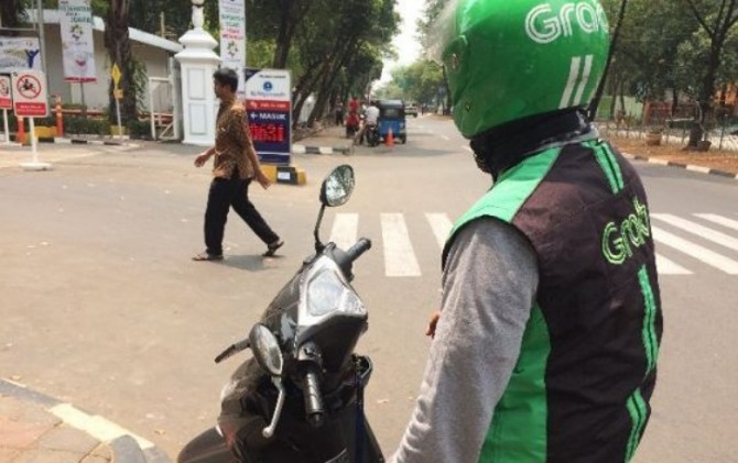 Ilustrasi driver Grab. (JawaPos.com)