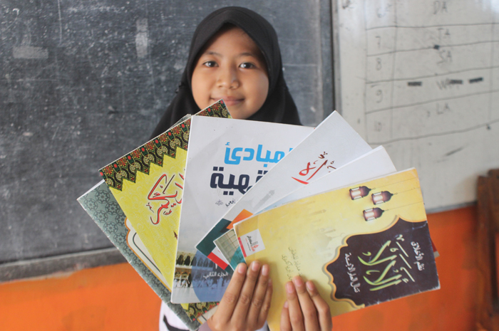 FOKUS: pembimbing pendidikan diniyah saat mengajar di SDN Sepanyul Kecamatan Gudo, Jombang.
