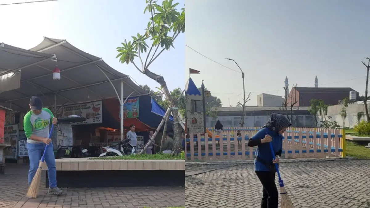 Kepala Dinas P dan K Jombang Wor Windari (kanan) dan Kepala DLH Jombang Miftahul Ulum (kiri) saat membersihkan sampah di area Sentra PKL, Jumat (17/4)