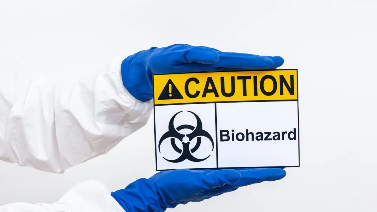 Simbol biohazard yang menjadi penanda standar pada area dan sampel patogen berisiko tinggi. (Magnific)