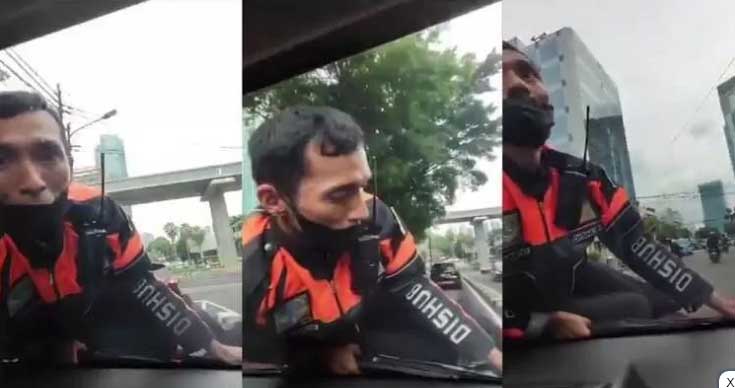 Tangkapan layar petugas Dishub yang nangkring di mobil warga dan terbawa hingga Menteng.