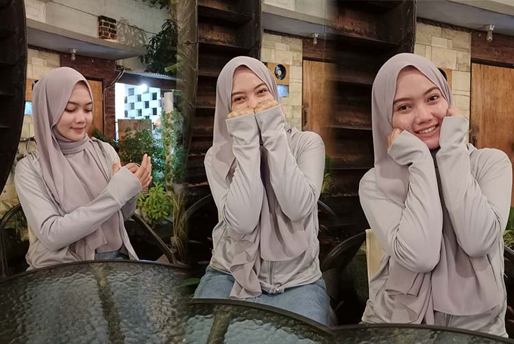 JAKET: Deby Azzahra, ngafe menggunakan jaket UV.