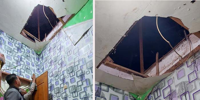 Petugas meninjau plafon rumah Siti Sumailah yang bolong usai kena lempar bondet.