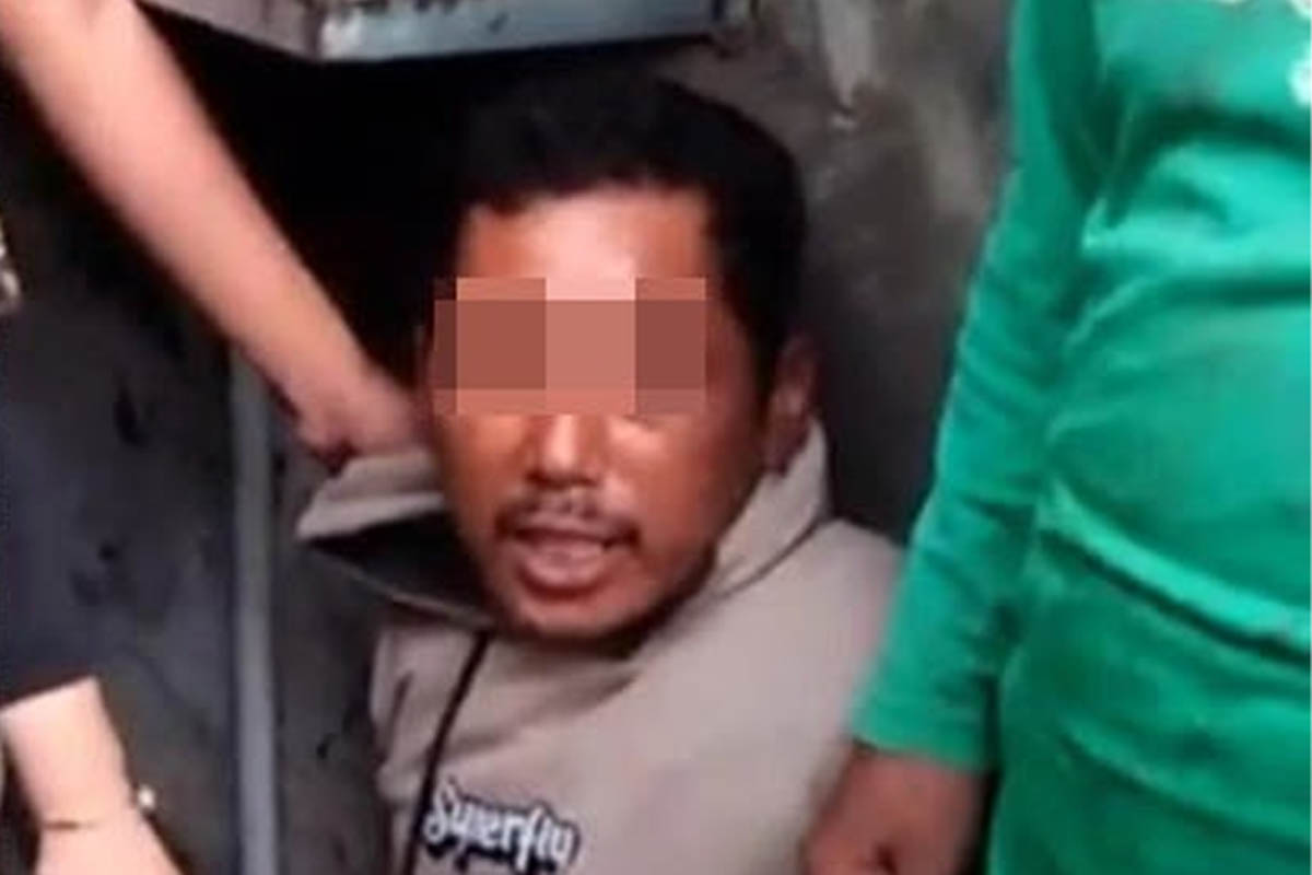 BABAK BELUR: HS, 45, warga Kecamatan Grati, Kabupaten Pasuruan, saat ditangkap massa.