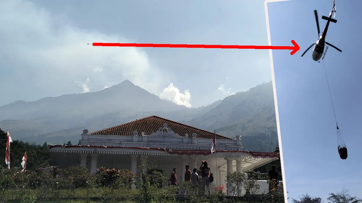 WATER BOMBING: Helikopter water bombing dikerahkan untuk padamkan api di lereng gunung Arjuno, Minggu (23/8). (Rizal Syatori/ Radar Bromo)