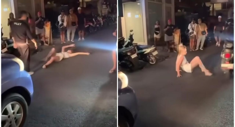 Seorang bule wanita menari dan berguling-guling di tengah jalanan Bali