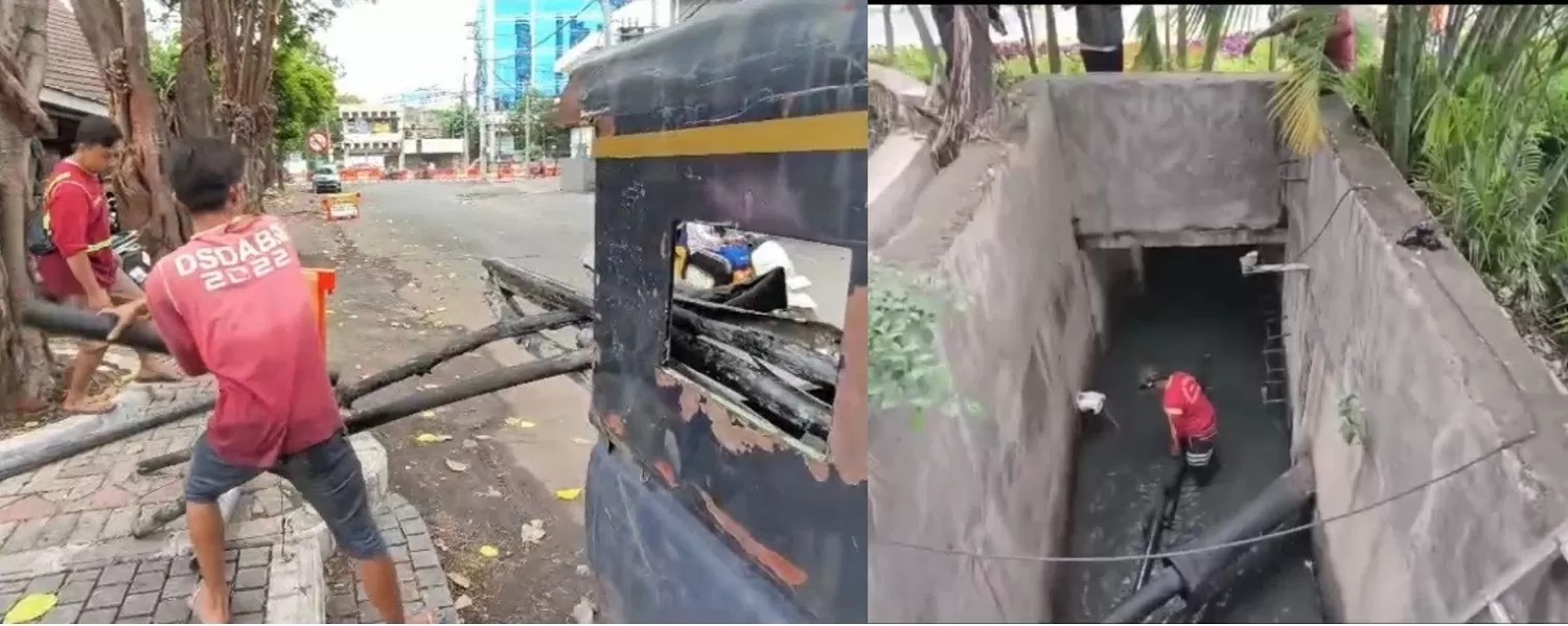 DILAPORKAN POLISI: Petugas DSDABM Surabaya membersihkan potongan kabel curian yang menyumbat saluran air di kawasan Kedungdoro dan Embong Malang. (DSDABM KOTA SURABAYA)