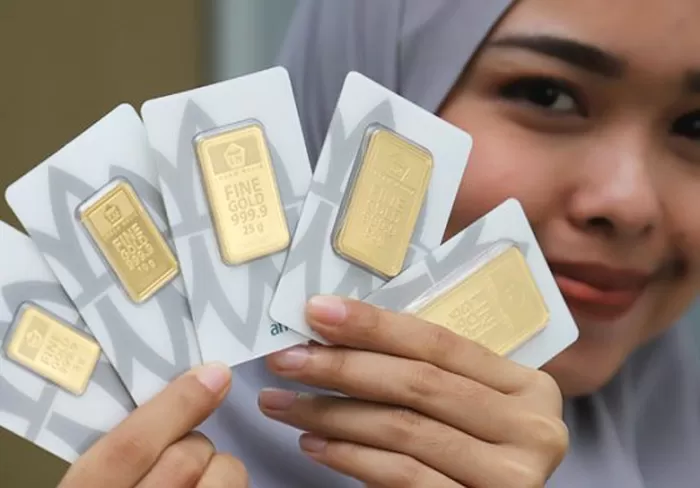 Ilustrasi emas batangan Antam.