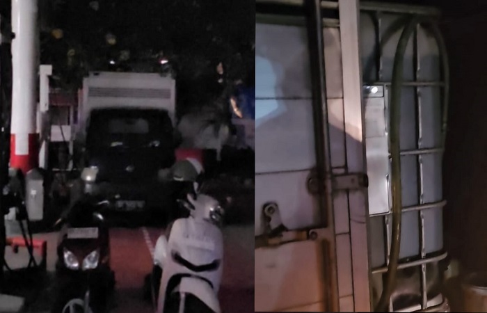 Petugas salah satu SPBU di Denpasar, melayani pembelian BBM subsidi pemerintah menggunakan Tandon Air yang ada di dalam mobil boks, Rabu malam 16 Oktober 2024.