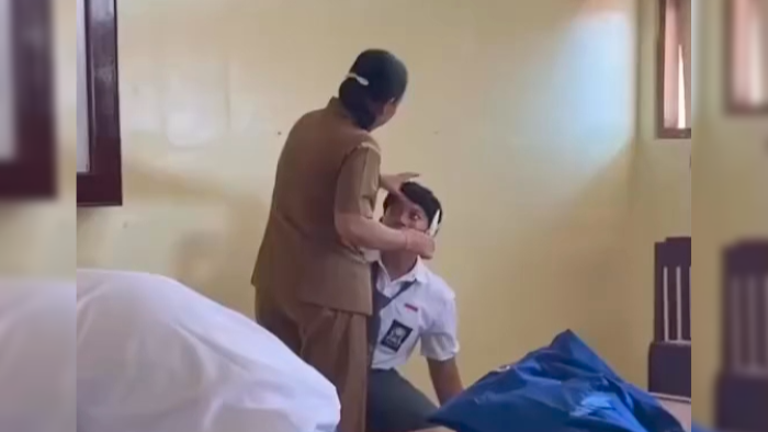 CUKUR RAMBUT: Cuplikan video seorang guru mencukur rambut siswa di salah satu SMK negeri di Buleleng.
