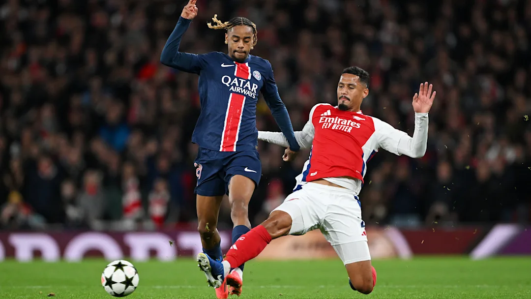 Arsenal FC v Paris Saint-Germain - UEFA Champions League 2024/25 League Phase, Bradley Barcola stopped by William Saliba.
