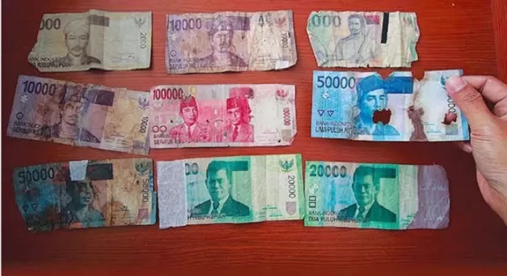 Ilustrasi uang lusuh.