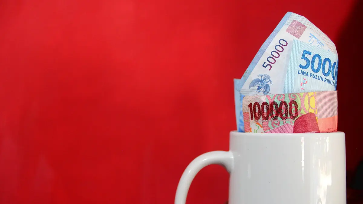 ILUSTRASI: Mata uang rupiah yang menguat tipis pada perdagangan Rabu (18/3/2026)