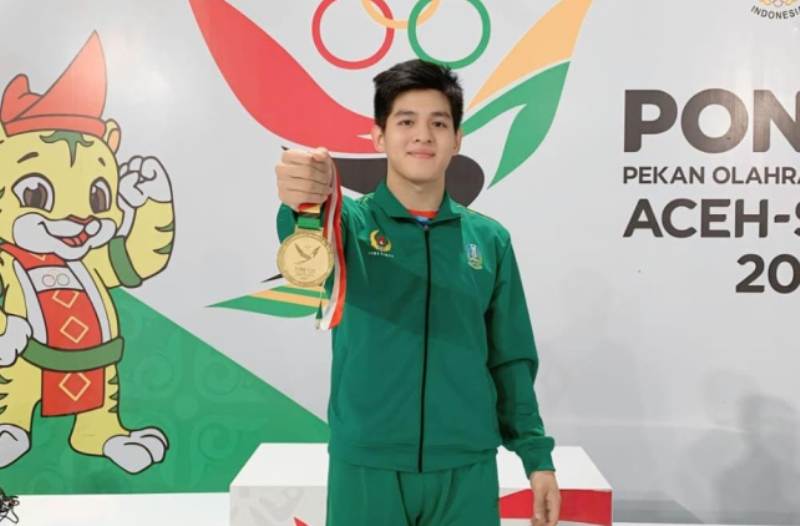 Artz Brilliant Perfecto Tanujaya atlet jujitsu asal Magetan wakil Jatim raih emas dalam PON XXI 2024. (AJI PUTRA/JAWA POS RADAR MAGETAN)