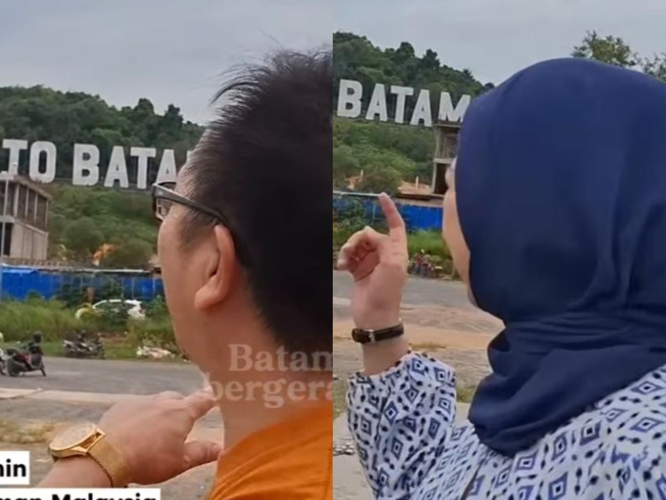 Wisatawan sedang menunjukkan ikon Welcom to Batam yang tertutup Bangunan