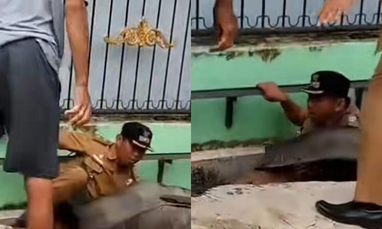 Detik-detik lurah di Medan tercebur ke parit usai didorong warga saat tertibkan polisi tidur ilegal di Jalan Madupuro.