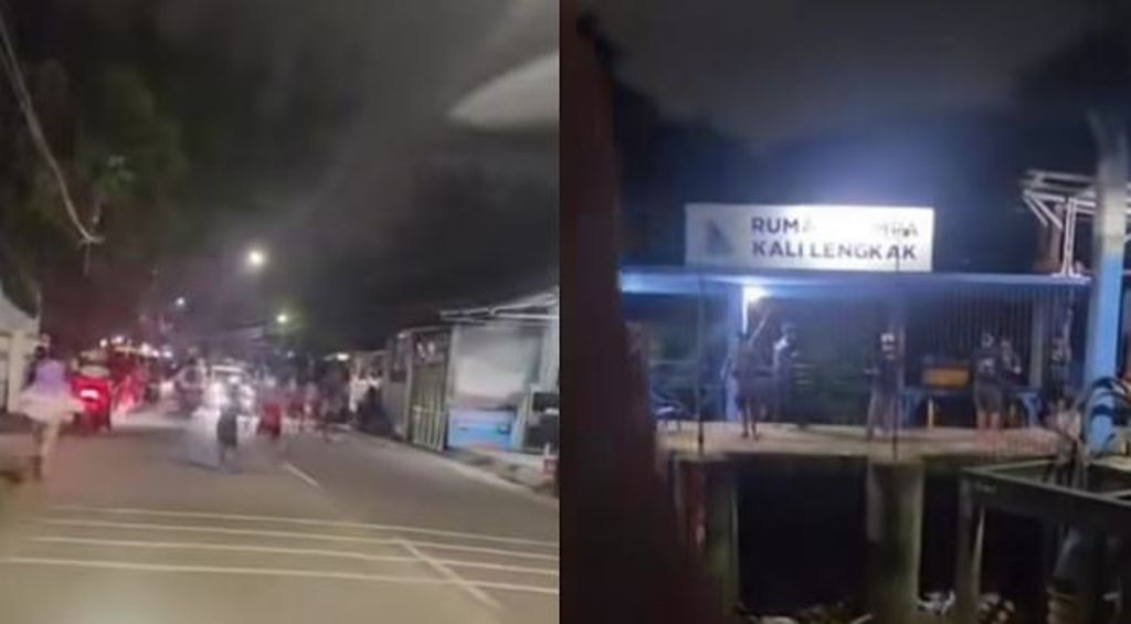 Warga Bekasi berlarian saat sirine peringatan banjir berbunyi.