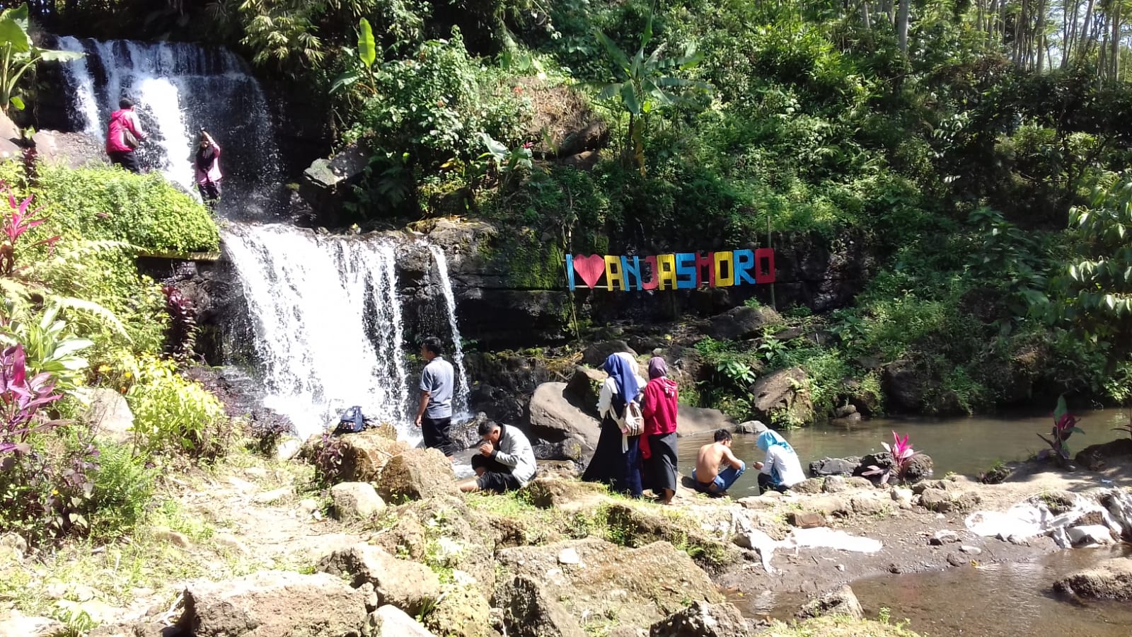 Surrounded by trees and fresh water, Anjasmoro Waterfall offers a fun and quiet place to visit. Photo: Delia Enggar Sugiana
