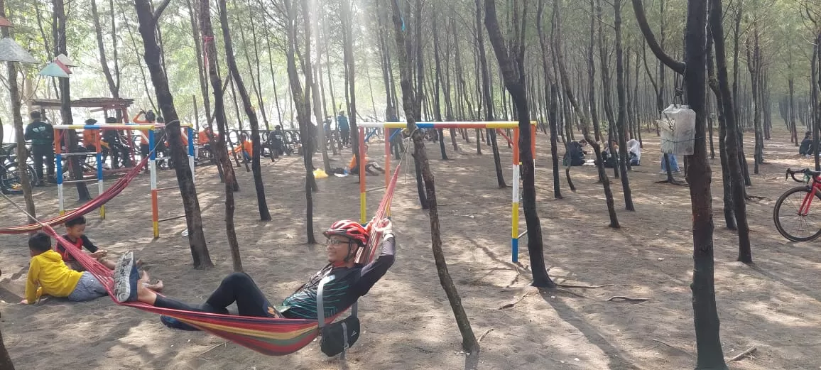 A visitor relaxed on a hammock at Cemoro Sewu Beach in Jember. Photo: Radar Jember
