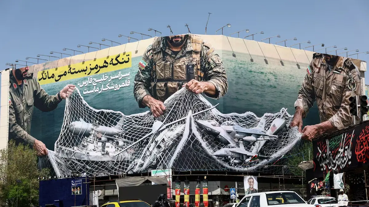  Cars drive near an anti-U.S. bilboard, amid the U.S.-Israeli conflict with Iran, in Tehran, Iran, April 5, 2026. Majid Asgaripour/WANA (West Asia News Agency) via REUTERS Purchase Licensing Rights