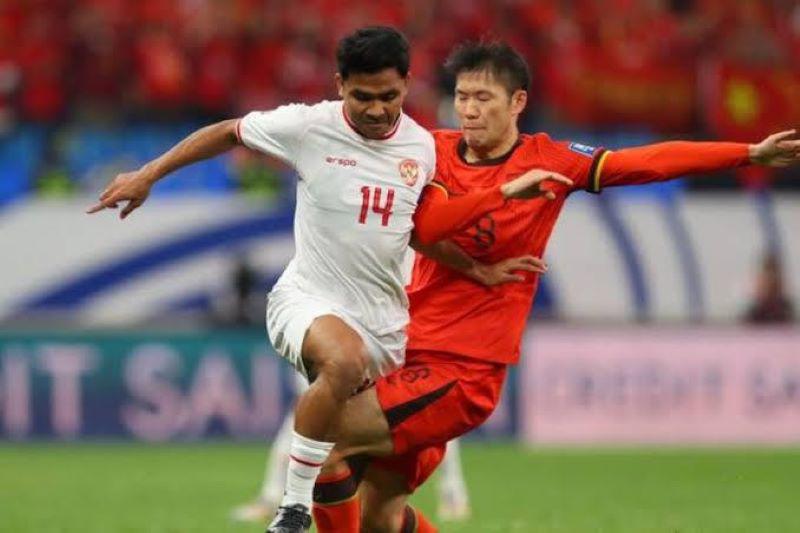 Ilustrasi pemain bola Indonesia vs China (Bola Net)