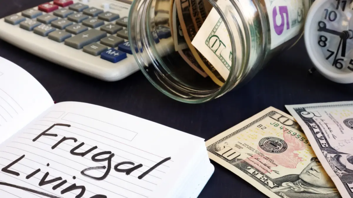 Frugal,Living,Written,On,A,Note,Pad,And,Money.