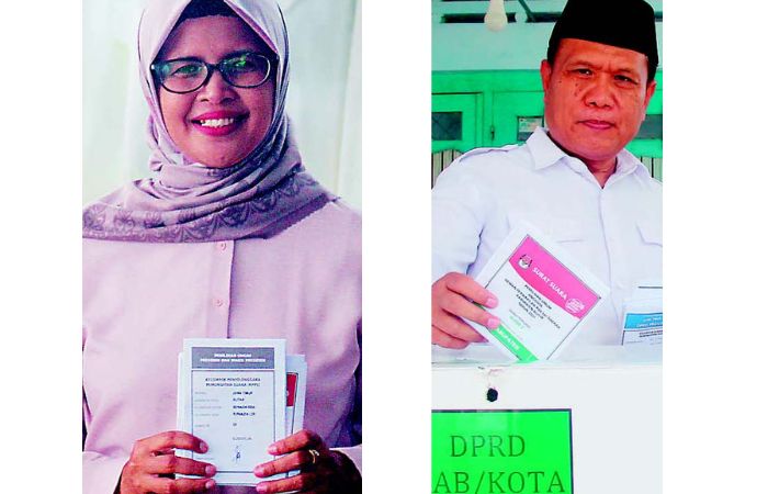 BANGUN PAGI: Bupati Rini Syarifah dan Sekretaris Daerah Izul marom menggunakan hak pilihnya Rabu (14/2).