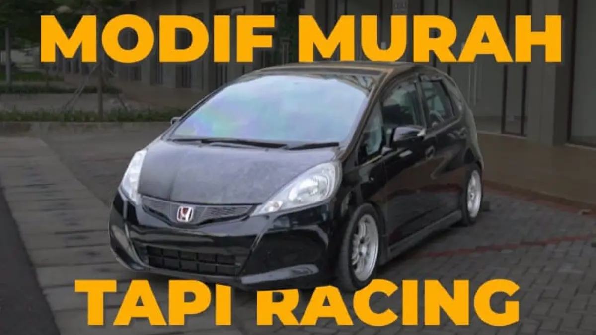 Honda Jazz RS 2011 matic ini tampil racing dengan velg, coilover, dan exhaust custom, tetapi mesinnya tetap nyaris standar. Simak detail modifikasinya.