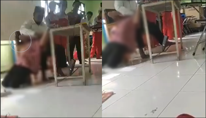 Tangkapan layar video guru mencekik siswa yang viral di Malang.