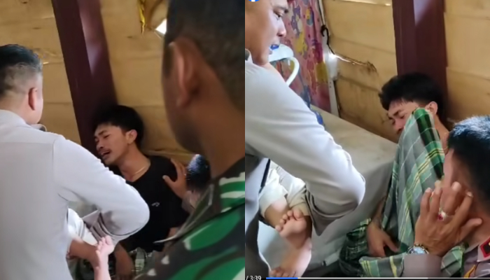 Petugas polisi satu ini tak kuasa menahan tangisannya saat melihat bocah korban penganiayaan ayah kandungnya di Pinrang.