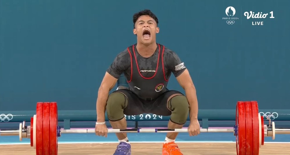 Rizki Juniansyah Peraih Medali Emas Cabor Angkat Besi.