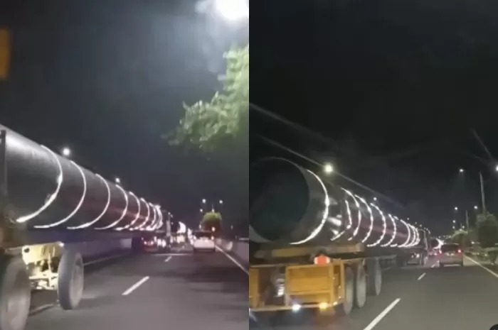 Truk pengangkut tabung raksasa atau autoclave saat melintas di jalan tol.