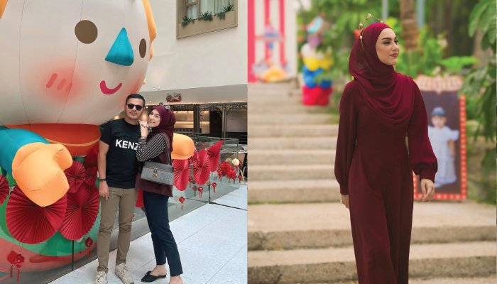 Irish Bella menggunakan pakaian berwarna burgundy.