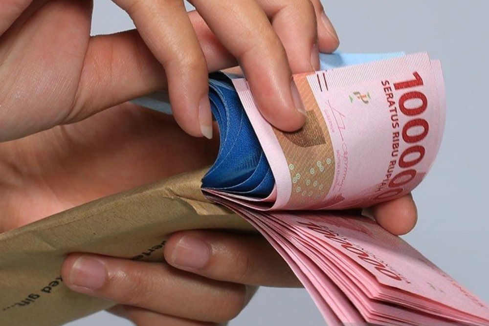 Ilustrasi uang rupiah. - Tips menghemat selama jalani Puasa Ramadan 2025.