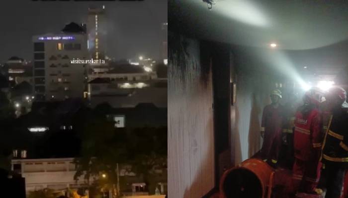 Asap mengepul dari bagian atas bangunan Grand HAP Hotel Solo, Jumat (7/3/2025) malam.