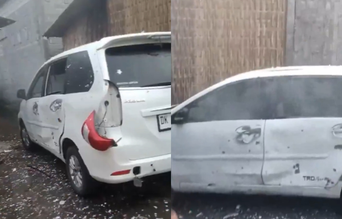 Penampakan mobil penyok diduga karena balon udara berisi mercon yang meletus.