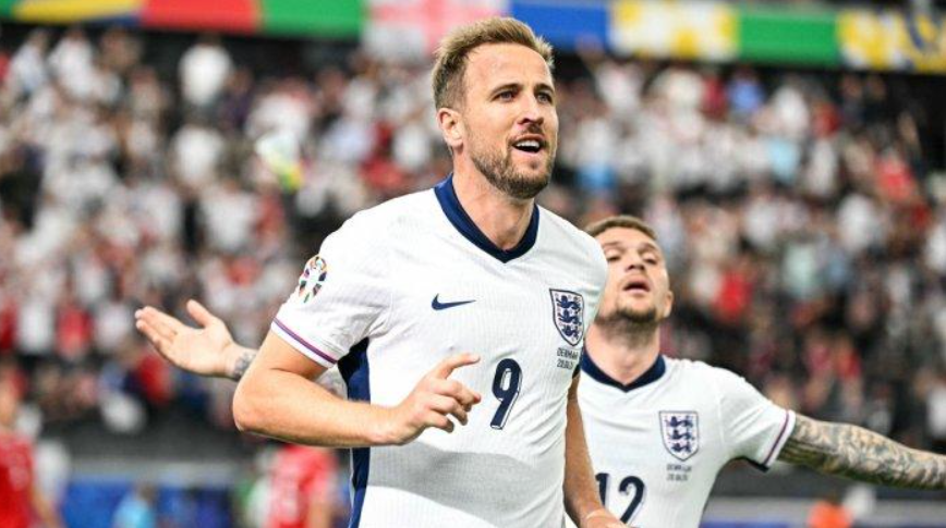 Penyerang Inggris #09 Harry Kane merayakan mencetak gol pertama timnya selama pertandingan sepak bola Grup C UEFA Euro 2024 antara Denmark dan Inggris di Frankfurt Arena di Frankfurt am Main pada 20 J