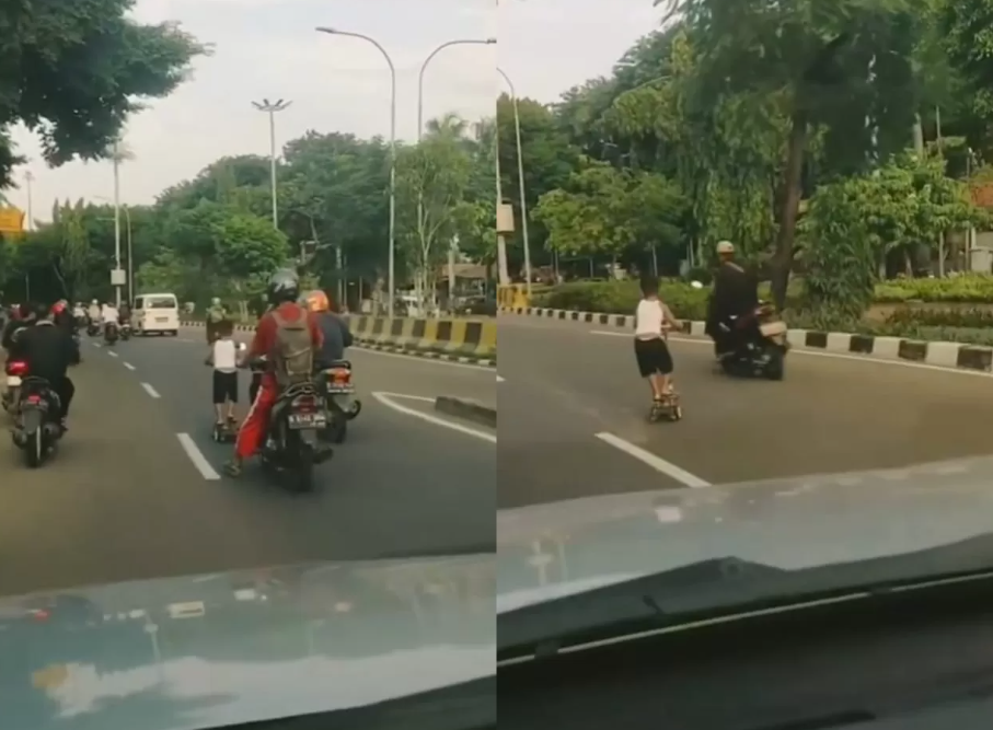 Aksi seorang bocah bermain skuter di depan Kantor Wali Kota Jakarta Timur pada Minggu (12/1). (Foto: X Radio Elshinta)
