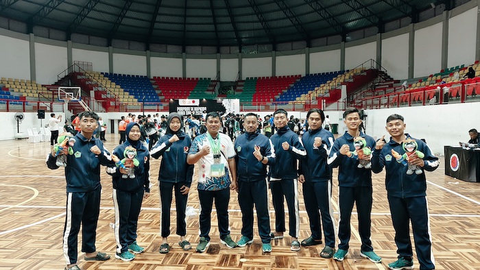 CATATAN PRESTASI: Atlet Hapkido Pamekasan berfoto bersama usai mengikuti Porprov IX Jawa Timur di Kabupaten Malang, Selasa (10/6).&nbsp;