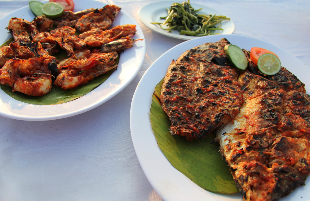 Ikan bakar Jimbaran khas Bali, kaya rempah dan aroma yang bikin lapar.