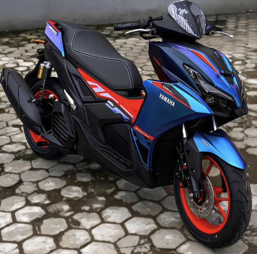 Yamaha Aerox Alpha Cyber City 2025 kini hadir dengan warna bunglon, fitur ABS, dan rem cakram belakang. Cek spesifikasi dan harga terbarunya