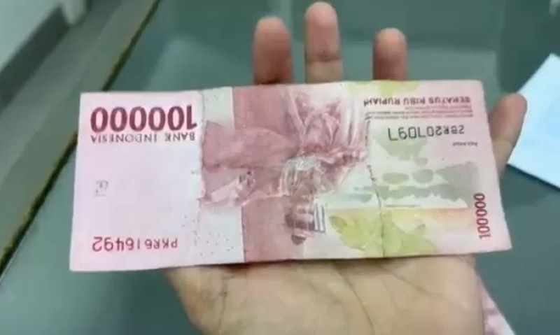 BIKIN HEBOH : Viral beredar uang mutilasi yang kabarnya setengah asli dan setengah palsu. (Istimewa/JPG)