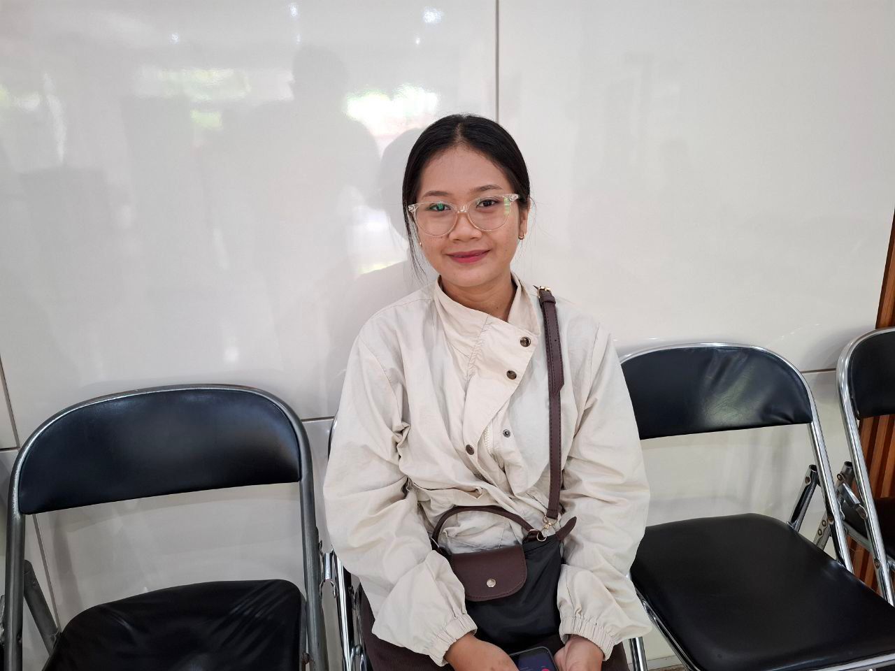 Dewi Pitriani, peserta JKN segmen Pekerja Penerima Upah (PPU) di salah satu perusahaan swasta.