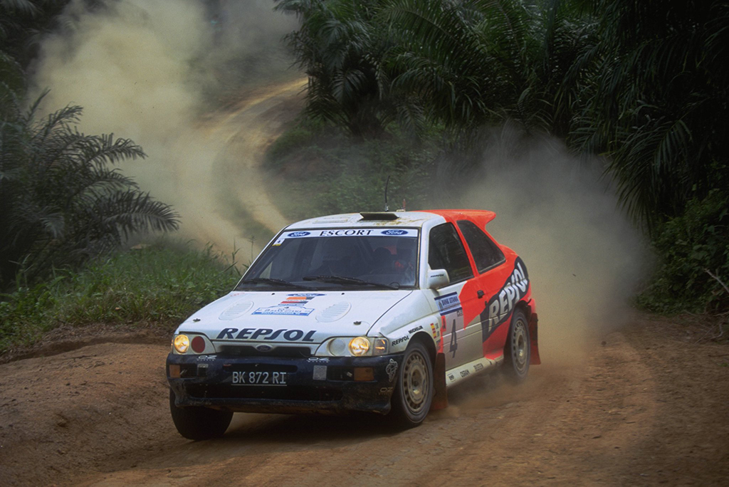 Jika tidak ada aral melintang, pemandangan mobil balap kelas dunia memakai plat nomor Indonesia dan  berlari di belakang rumah warga dan perkebunan dapat kembali terwujud. (Dok. motorsport Images)